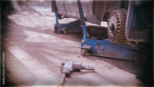 car at a tire service during the seasonal replacement of tires with winter ones