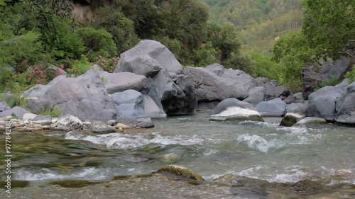 Gole Alcantara botanical and geological park, rushing mountain river with geological rocks formations, Sicily, Italy
