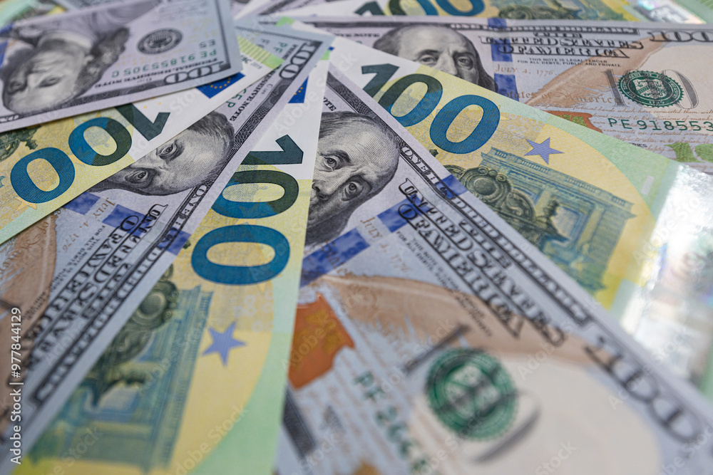 US 100 dollar and 100 euro banknotes background for design purpose US 100 dollar and 100 euro banknotes background for design purpose