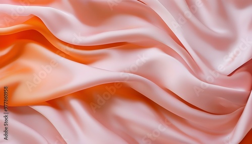 Elegant waves of soft pink and orange silk fabric embodying luxury, fluidity, grace, and sophistication in a close-up shot