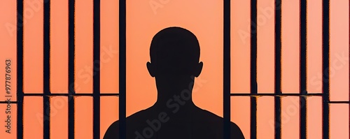 A conceptual image of a prisoner s shadow against the bars, capturing the psychological impact of incarceration photo