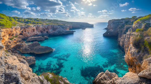 A picturesque coastline with turquoise coves and rocky cliffs under a bright sunny sky. photo