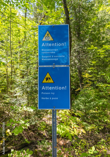 Rattlesnake and Poison Ivy Warning Signs at the Recollete Falls Trailhead in French River Area