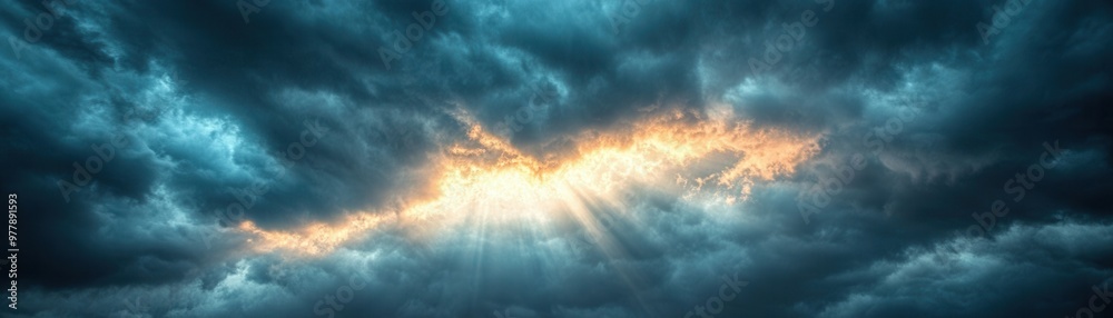 A dramatic sky with dark storm clouds parting to reveal a glowing line of sunlight pouring through, ideal for concepts of hope, inspiration, and nature's power in backgrounds A dramatic sky with dark storm clouds parting to reveal a glowing line of sunlight pouring through, ideal for concepts of hope, inspiration, and nature's power in backgrounds