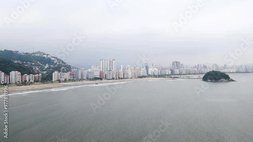 Landscape of Santos city with view to the Urubuquecaba Island, the breakwater, the beach and the city on background. Coast of the interior of Sao Paulo, SP, Brazil. photo