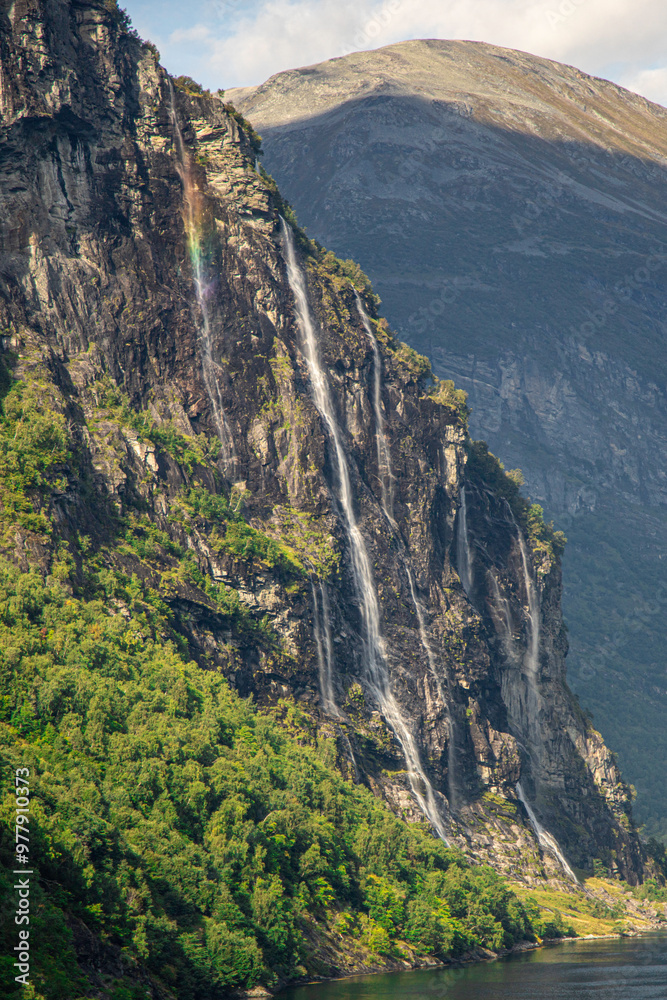 View of a rainbow in the seven sisters waterfall Norway View of a rainbow in the seven sisters waterfall Norway