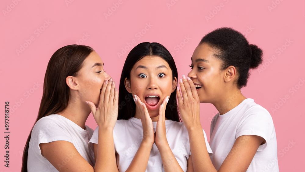Rumors Concept. Three Young Women Sharing Gossips And Secrets Standing Over Pink Background. Studio Shot, Panorama Rumors Concept. Three Young Women Sharing Gossips And Secrets Standing Over Pink Background. Studio Shot, Panorama