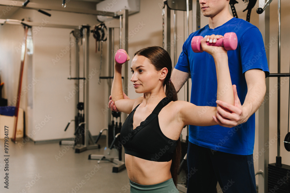 Fototapeta premium Doing kinesiology therapy to cardiovascular and pulmonary systems. Young woman is doing supervised therapeutic gymnastics to optimize physical performance.