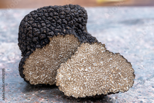 Tapety artystyczne Delicious mushrooms, fresh black summer truffle mushroom in pieces for making truffle dishes with tasty aroma