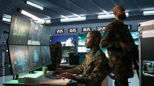 Vászonkép Army professional employing AI tech to improve military combat systems and missiles monitoring