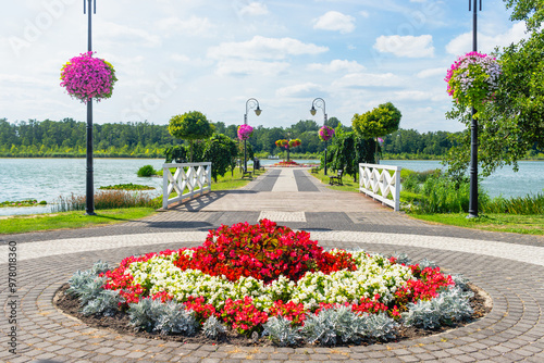 Summer landscape at Quay of Jezioro Berzyńskie lake in Wolsztyn, Greater Poland (Wielkopolska) covered in flowers.