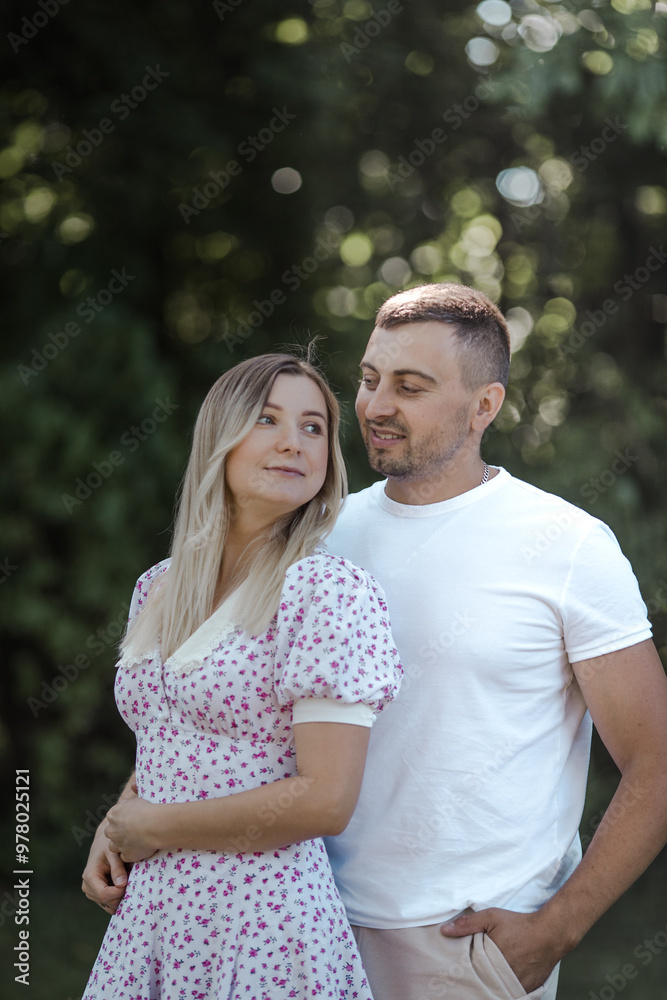 Fototapeta premium Happy couple at public park. Loving young couple having fun outdoors