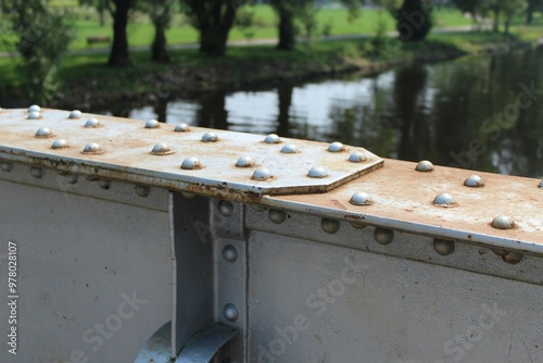 Obraz na plátně Riveted metal plates on bridges in diminished perspective
