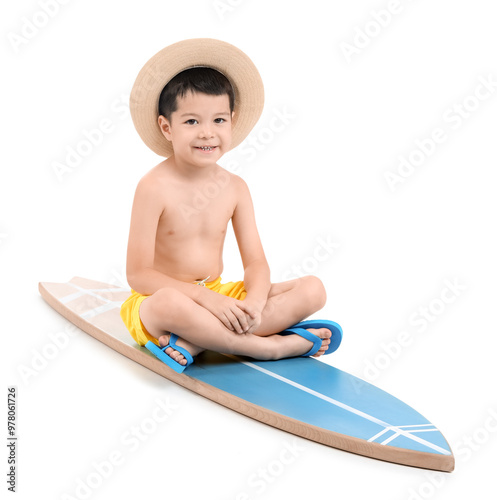 Cute little Asian boy sitti...