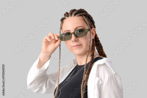 Young woman with dreadlocks...