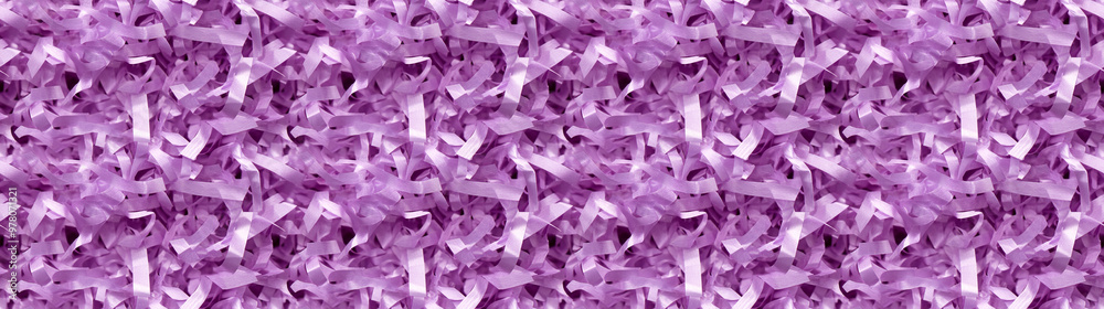 Fototapeta premium shredded paper filler in amethyst purple color with thindelicate strips, shredded paper filler texture background