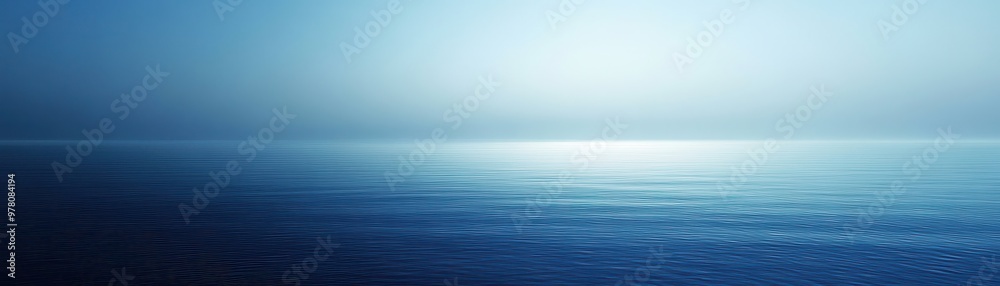 Fototapeta premium Calm Blue Water Surface with a Hazy Sky