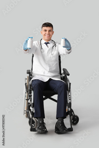 Young male doctor in wheelc...