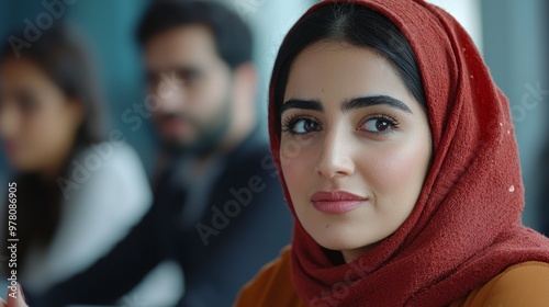 Confident Middle Eastern Businesswoman Leading Strategy Discussion with Attentive Colleagues in Meeting