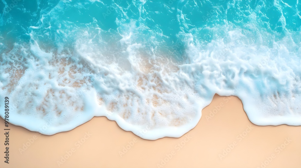 Obraz premium Aerial view of tranquil ocean waves gently lapping on a sandy beach, evoking a sense of relaxation and serenity.