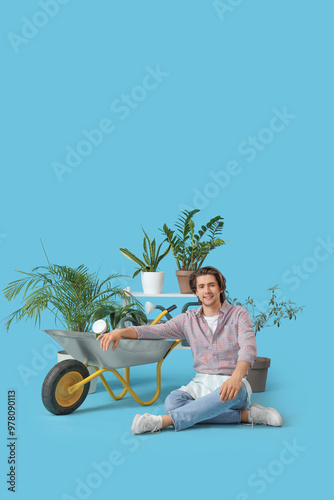 Handsome gardener with trol...