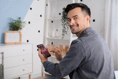 Young man using mobile phon...