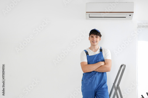 Male worker repairing air c...