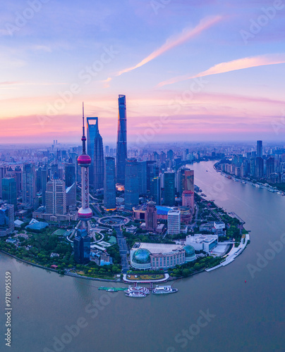 Aerial view of modern city skyline and buildings at sunrise in Shanghai