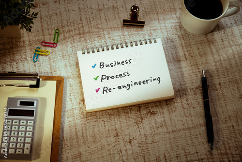 There is notebook with the word Business Process Re-engineering. It is as an eye-catching image. photo