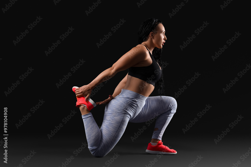 Female bodybuilder on black background Female bodybuilder on black background