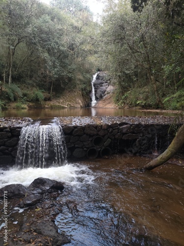 Beautiful intimate waterfall with trees around