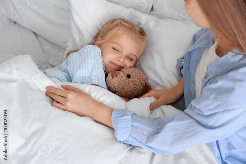Cute little girl with toy b...