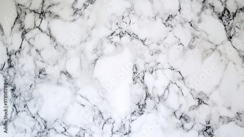 Smooth marble texture with subtle white and gray veins on a polished surface, offering a sleek and elegant natural stone appearance.