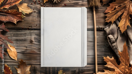 Whimsical Notebook Cover with Autumn Leaves and Witch's Broom on Rustic Wooden Table