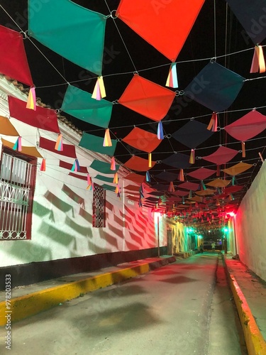 Colorful street decorated with paper kites near Carupano Ateneo, historic centre. Carúpano is considered the gateway to the Paria Peninsula and its main commercial and financial center. photo