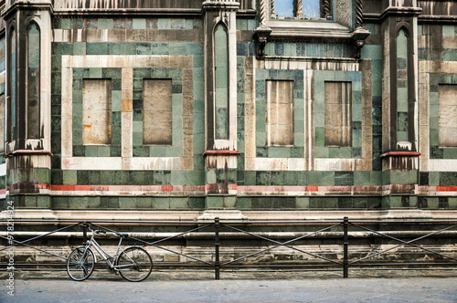 Vintage bicycle by historic Florentine building with intricate details photo