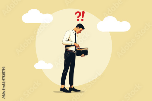 Financial management concept, A businessman stands while looking at the empty contents of his wallet