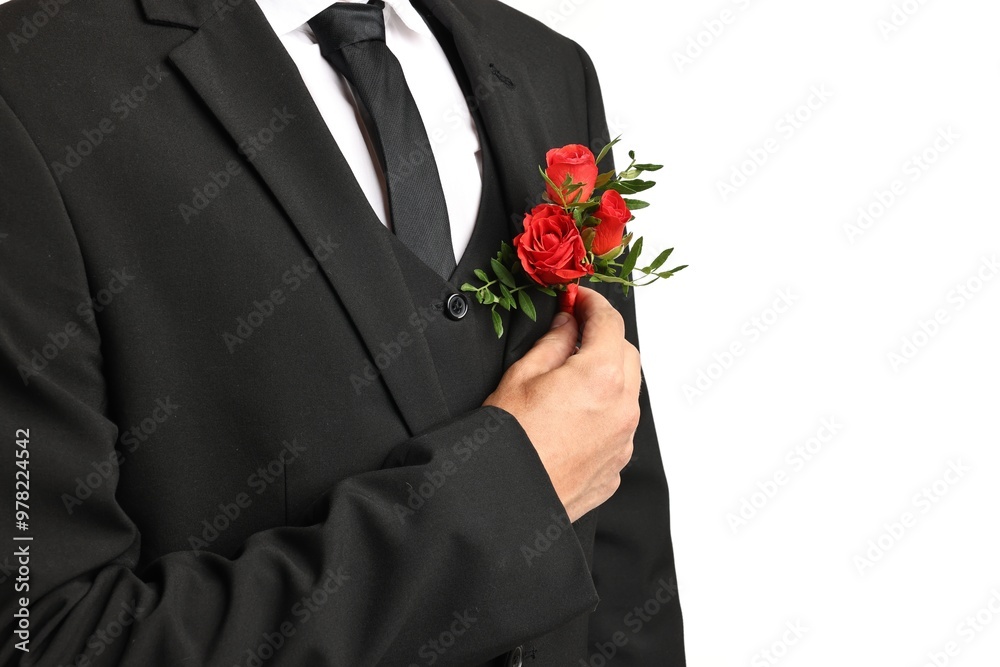 Groom in suit with stylish boutonniere on white background, closeup