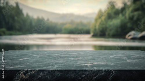 A serene landscape with a stone table overlooking a calm river and lush greenery.