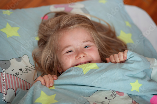 Little girl in the bed