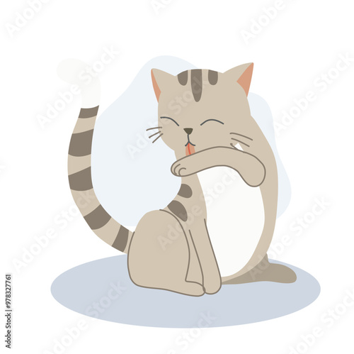 Cute kitten licking its arm for self-grooming,  cleanliness.  Adorable pet hygiene.