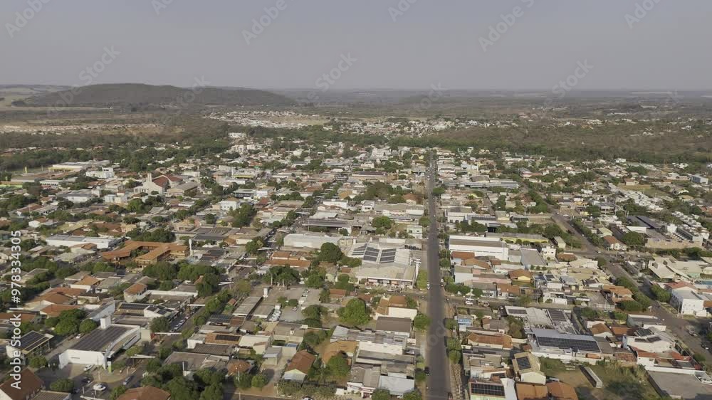 Drone flies high over city in late afternoon toward Praça da Liberdade in Bonito, Mato Grosso do Sul, Brazil Drone flies high over city in late afternoon toward Praça da Liberdade in Bonito, Mato Grosso do Sul, Brazil