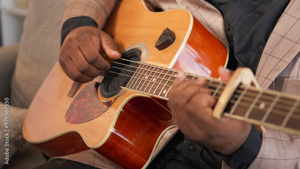 Obraz premium Guitar musician. Talented performer. Creative hobby. Inspired man hands playing blues song melody on string acoustic instrument on couch at home.