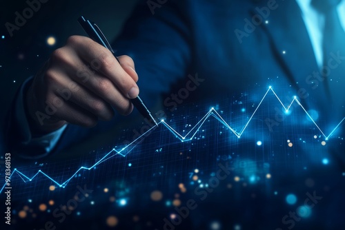 Businessman drawing a growth graph with a digital screen and financial data, a Business people concept on a blue background.