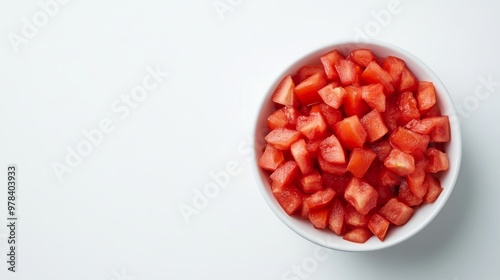 36. High-angle view of a bowl filled with freshly diced tomatoes, isolated on a white background, emphasizing their vibrant red color and juicy texture