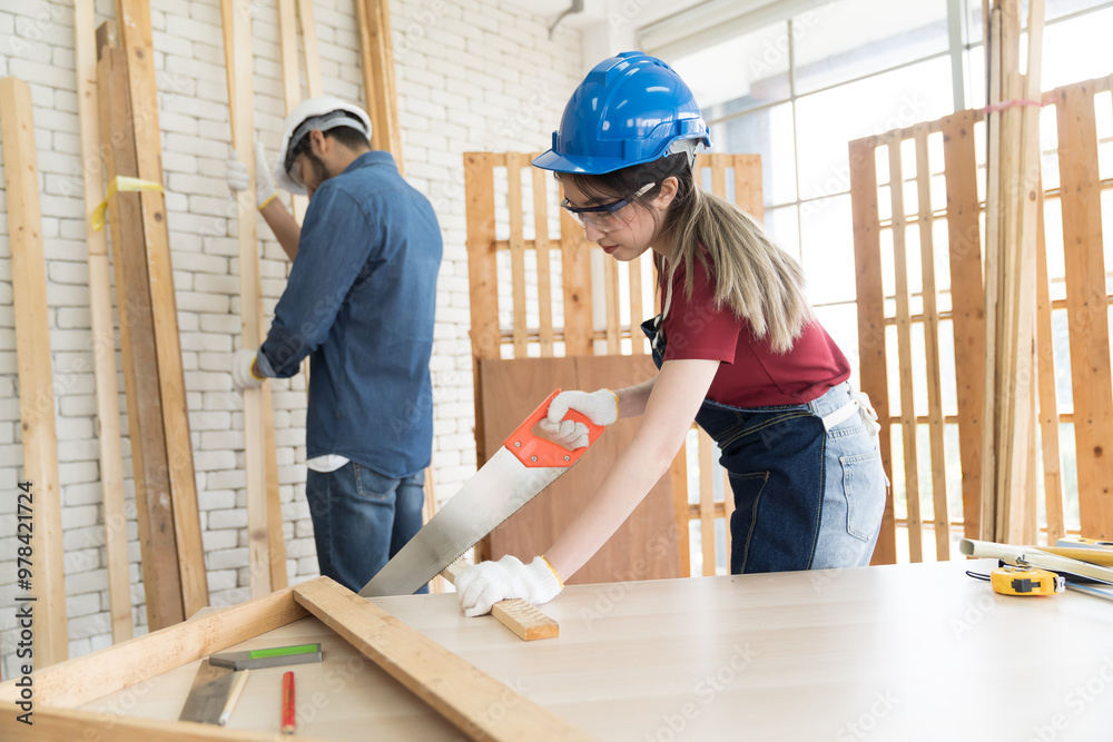 Asian woman carpenter working and building furniture at wood workshop. Asian joiner woman making furniture at furniture workshop Asian woman carpenter working and building furniture at wood workshop. Asian joiner woman making furniture at furniture workshop