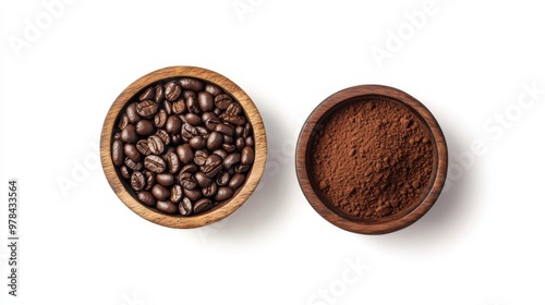 7. Flat lay of a wooden bowl filled with roasted coffee beans next to a bowl of rich coffee powder, isolated on a clean white background