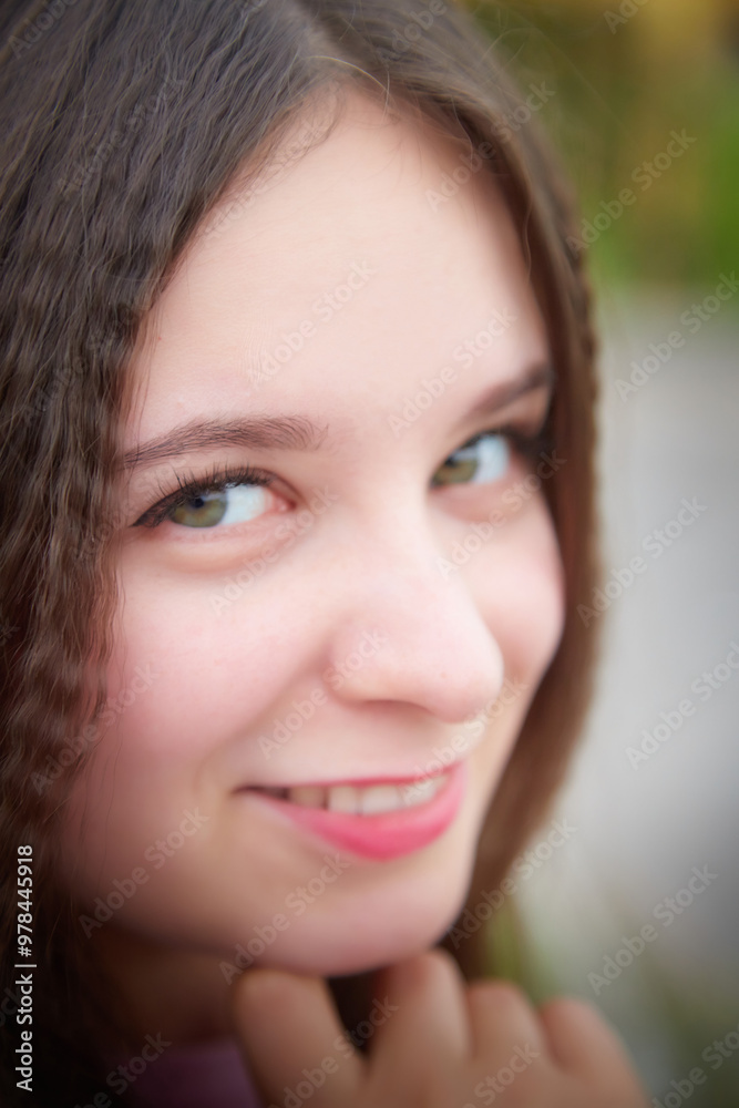 Fototapeta premium Portrait of young pretty woman with long brown hair
