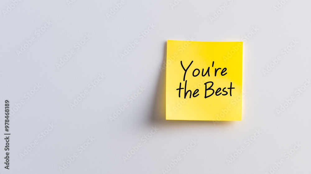 Sticky Note: A single yellow sticky note with the words 