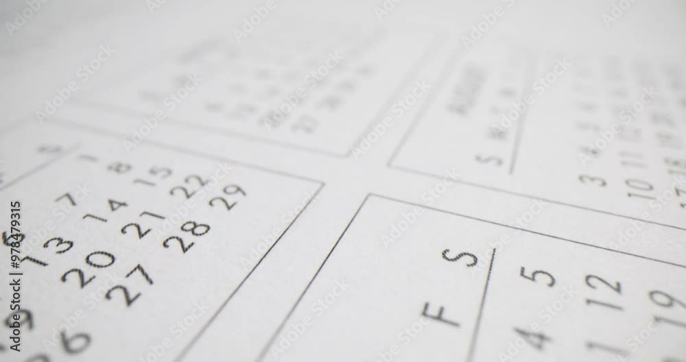 Closeup of calendar with the months of April and August